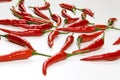 Fresh pods of red chilli peppers on white background, close up Royalty Free Stock Photo