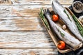 Fresh Pollock fish. Raw seafood. White wooden background. Top view. Copy space