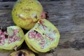 Open section of a pomegranate fruit exposing the ripe red seeds within. Healthful natural fruits for cancer patient