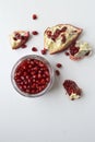 Fresh pomegranate on white background. Top view with copy space.