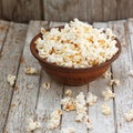 Fresh popcorn in bowl on white wooden table Royalty Free Stock Photo