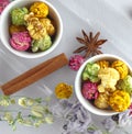 Fresh popcorn in yellow bowl on white wooden table. Selective focus. Royalty Free Stock Photo