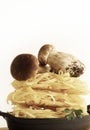 Fresh porcini mushroom and raw pasta.