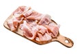 Fresh pork bacon on a chopping Board. Organic raw pork meat. Isolated on white background. Top view. Royalty Free Stock Photo
