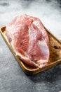 Fresh pork cuts. Raw meat with spices. shoulder  butt part. Gray background. Top view Royalty Free Stock Photo