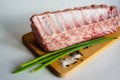 Fresh pork loin on the bone, pork ribs on a wooden cutting board Royalty Free Stock Photo