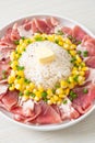 Fresh pork raw sliced with rice and corn on plate and ready to cook Royalty Free Stock Photo