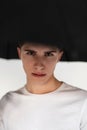 Fresh portrait serious young man in stylish t-shirt with black umbrella isolated on white background in studio. Good-looking Royalty Free Stock Photo