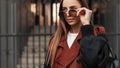 Fresh portrait urban girl in trendy clothes outdoors. Modern young hipster woman in stylish trench coat with black leather Royalty Free Stock Photo