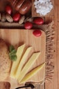 Fresh potatoes for cooking on wood background. Royalty Free Stock Photo