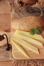 Fresh potatoes for cooking on wood background. Royalty Free Stock Photo