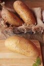 Fresh potatoes for cooking on wood background. Royalty Free Stock Photo