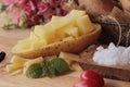 Fresh potatoes for cooking on wood background. Royalty Free Stock Photo