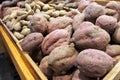 Fresh potatoes and kumara on display in farmers market Royalty Free Stock Photo