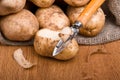 Fresh potatoes is peeled with a kitchen knife Royalty Free Stock Photo