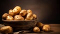 Fresh potatoes in rustic wooden bowl on wooden table Royalty Free Stock Photo