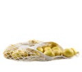 Fresh potatoes in a string bag on a white background. Royalty Free Stock Photo