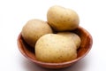 Fresh potatoes in wooden bowl Royalty Free Stock Photo