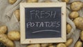 Fresh potatoes written Royalty Free Stock Photo