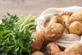 Fresh potatos in potato bag after harvest, dill, parsley, top view Royalty Free Stock Photo