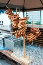 Fresh German pretzels on a wooden rack to beer Royalty Free Stock Photo