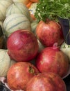 Fresh produce with pomegranates, rockmelons, parsley