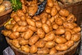 Yellow young potatoes pile in a basket at grocery shop Royalty Free Stock Photo