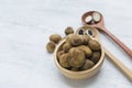 Fresh Puffball mushroom in round wooden bowl on white table background