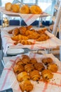 Fresh puffy pastry on decorated shelf at French patisserie store Royalty Free Stock Photo