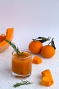 Fresh pumpkin juice drink on white table