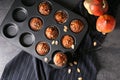 Fresh pumpkin muffins in baking form Royalty Free Stock Photo