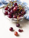 Fresh purple grape fruit on bowl, blue napkin. Royalty Free Stock Photo