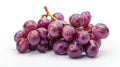 Fresh purple grapes with water droplets on a white background, showcasing their glossy and plump appearance Royalty Free Stock Photo