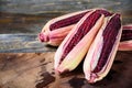 Fresh purple sweet corn on wooden background Royalty Free Stock Photo