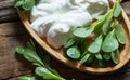 Fresh purslane Portulaca oleracea, edible weeds with yoghurt on wooden table Royalty Free Stock Photo