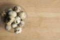 Fresh quail eggs in a glass bowl on a wooden table background Royalty Free Stock Photo
