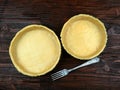 Fresh quiche dough in the baking trays