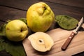 Fresh Quince fruit on wooden table