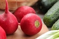 Fresh radish. Spring fresh vegetables radishes, cucumber, green onions and greens on a white wooden table. ingredients for cooking Royalty Free Stock Photo