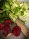 Fresh Radishes and Bok Choy slice on a cutting board Royalty Free Stock Photo