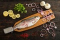 Fresh rainbow trout on a special wooden fish cutting board