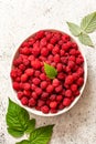 Fresh raspberries in bowl. Ripe juicy fresh raspberries