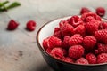 Fresh raspberries in bowl. Ripe juicy fresh raspberries. Organic raspberries, healthy food, vitamins, summer berry fruit. Long