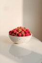 Fresh raspberries in ceramic bowl isolated on white background Royalty Free Stock Photo