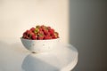 Fresh raspberries in ceramic bowl isolated on white background Royalty Free Stock Photo