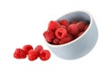 Fresh raspberries falling from bowl isolated on white Royalty Free Stock Photo