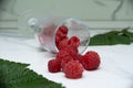 Fresh raspberries in a glass on the table. Healthy and vitamine food