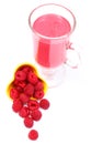 Fresh raspberries pouring out of yellow bowl and fresh cocktail Royalty Free Stock Photo