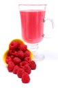 Fresh raspberries pouring out of yellow bowl and fresh cocktail Royalty Free Stock Photo