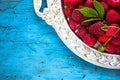 Delicious Fresh raspberries in vintage basket vitamins healthy food vegan ingredients. Selective focus Royalty Free Stock Photo